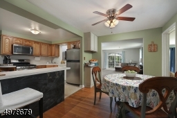 easy access  to family room, living room & four season porch.