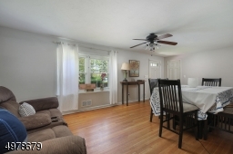 Hard wood floors, coat closet & ceiling fan.