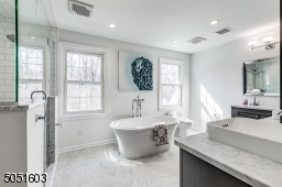 Updated Primary bath with soaking tub, radiant heat floors.