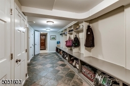Lower level Mud Room that leads to garage. Lots of storage & extra space.