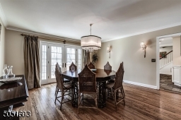 Formal Dining Room with hardwood floors, door leading to deck.