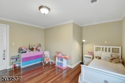 BR#3 with hardwood floors and a large closet