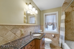 Hall bathroom with shower over tub