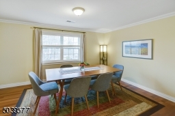 DR off kitchen with hardwood floors