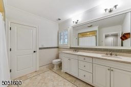 Two Bedrooms share a Full Bathroom with a double sink vanity