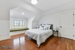 Bedroom 6 / Sitting Room  with baseboard molding, vaulted ceiling, walk-in closet, additional storage