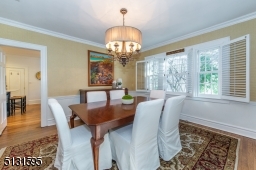 The dining room welcomes formal gatherings, while the living room invites you to relax and unwind in front of a stately fireplace