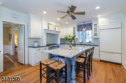 Chefs will love the dream kitchen and breakfast room featuring bright windows, custom cabinetry, a large center island and high-end Viking and Sub-Zero stainless steel appliances.
