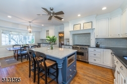 Chefs will love the dream kitchen and breakfast room featuring bright windows, custom cabinetry, a large center island and high-end Viking and Sub-Zero stainless steel appliances.