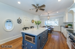 Chefs will love the dream kitchen and breakfast room featuring bright windows, custom cabinetry, a large center island and high-end Viking and Sub-Zero stainless steel appliances.