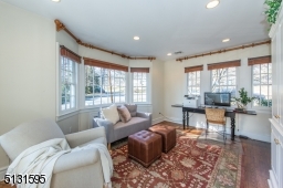 Two sets of French doors open to a family room and onto the fenced backyard and patio, creating an outstanding indoor-outdoor flow.