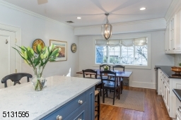 Chefs will love the dream kitchen and breakfast room featuring bright windows, custom cabinetry, a large center island and high-end Viking and Sub-Zero stainless steel appliances.