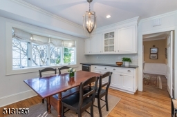 Chefs will love the dream kitchen and breakfast room featuring bright windows, custom cabinetry, a large center island and high-end Viking and Sub-Zero stainless steel appliances.