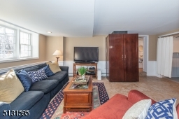 The home's fully finished walk-out lower level includes an expansive rec room, laundry and storage.