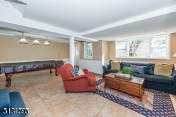 The home's fully finished walk-out lower level includes an expansive rec room, laundry and storage.