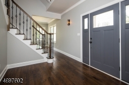 Upon entering the front door, admire the finer details like the wrought iron railing.