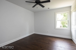 Second of four bedrooms on the second floor, all with ceiling fans.
