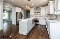Stainless steel appliances and wonderful white cabinetry really beautify this kitchen.