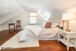 Third floor bedroom with one closet and 2 attic areas w/has storage and HVAC