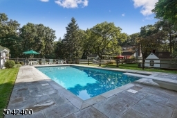 LARGE INGROUND  HEATED POOL AND POOL HOUSE.