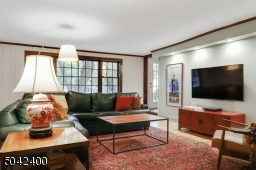 STEP DOWN FAMILY ROOM OPENS TO BREAKFAST ROOM AND LIVING ROOM.