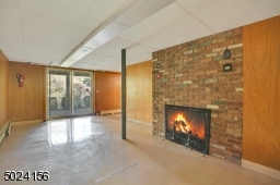 Finished walk out basement with a fire place!  So many possibilities.