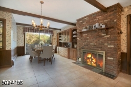 Imagine having your morning coffee next to the fireplace in the kitchen! 1 of 3 fireplaces.