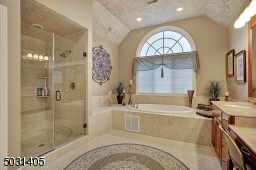 Discerning Master bath with jetted tub, large  shower and double sink vanity with make up counter
