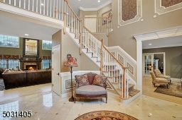 Two story foyer with Marble floor & custom Moldings