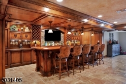 Amazing space for your guests - sophisticated custom cabinets & built ins this wet bar has a dishwasher/ice machine & wine refrigerator