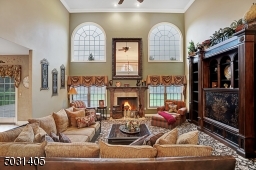 Two story room with gas fireplace