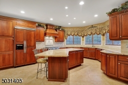 All Viking Appliances including a 6 burner gas range and additional wall oven/granite counters