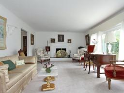 Large window, marble fireplace, wall to wall carpeting over oak floors are some of the wonderful features of this home.