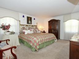 Bright and sunny bedroom with 2 walk in closets and updated master bath.