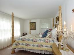 Bedroom with wall to wall carpeting over oak floors,  This bedroom is large enough to accomodate a king sized bed.