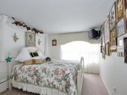 This room can easily accomodate a king sized bed.  The bedrooms in this home are spacious and bright.