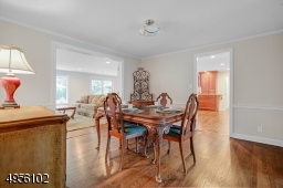 Dining room with French doors into Kitchen, family room and office/den and Living room