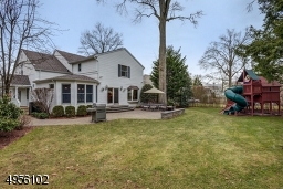 Stone wall, patio, specimen plantings surround makes for a quiet relaxed atmosphere.