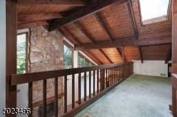 Overlooking the main level with views of the picturesque yard.