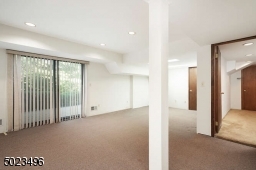 There is a full bathroom, laundry, large closet. sliders lead to the paver patio.