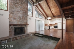 Floor to ceiling magnificent wood burning fireplace.