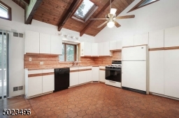 Skylights, vaulted ceilings, sliders to the deck.