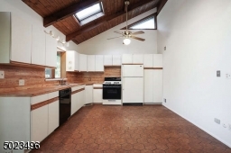 Spacious kitchen is open to the dining area and LR with sliders to deck.