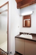 Stall shower, separate area with laundry hookups if desired.