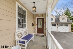 Covered bluestone Front and Rear Porches with hanging lights