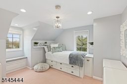 Bedroom 4 is en-suite and features wall-to-wall carpeting,  three exposures of windows, recessed lights and  three closets