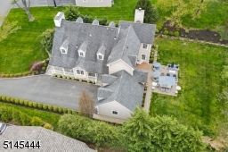 Sensational fully updated and expanded custom Colonial located in the desirable Poets' section with stunning views of Canoe Brook Country Club golf course. New driveway with Belgian block apron, Underground sprinkler system + newer windows.
