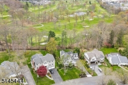 The rear yard backs to the elite Canoe Brook Country Club golf course