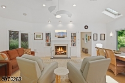 With a gas fireplace, built-in bookshelves and vaulted ceiling.