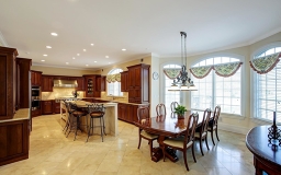 Beautiful cabinetry, granite counter tops, access to deck, Morning coffee overlooking Lake
